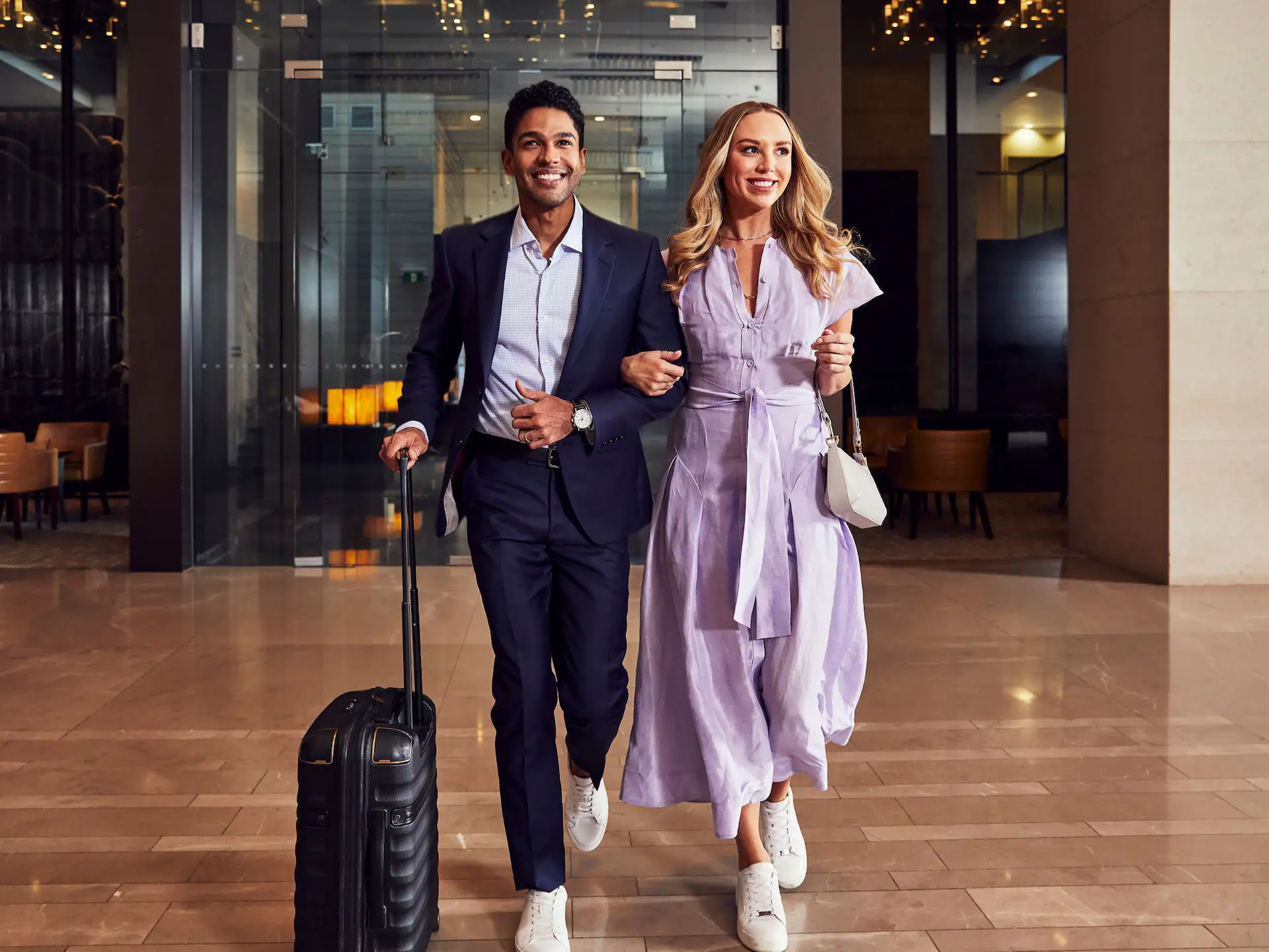 GLOBAL-P0872-Lobby-Couple-Walking.4x3